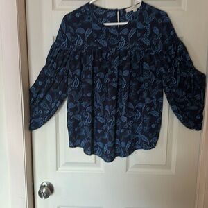 A size small blouse sold by the Loft  long puffy sleeve